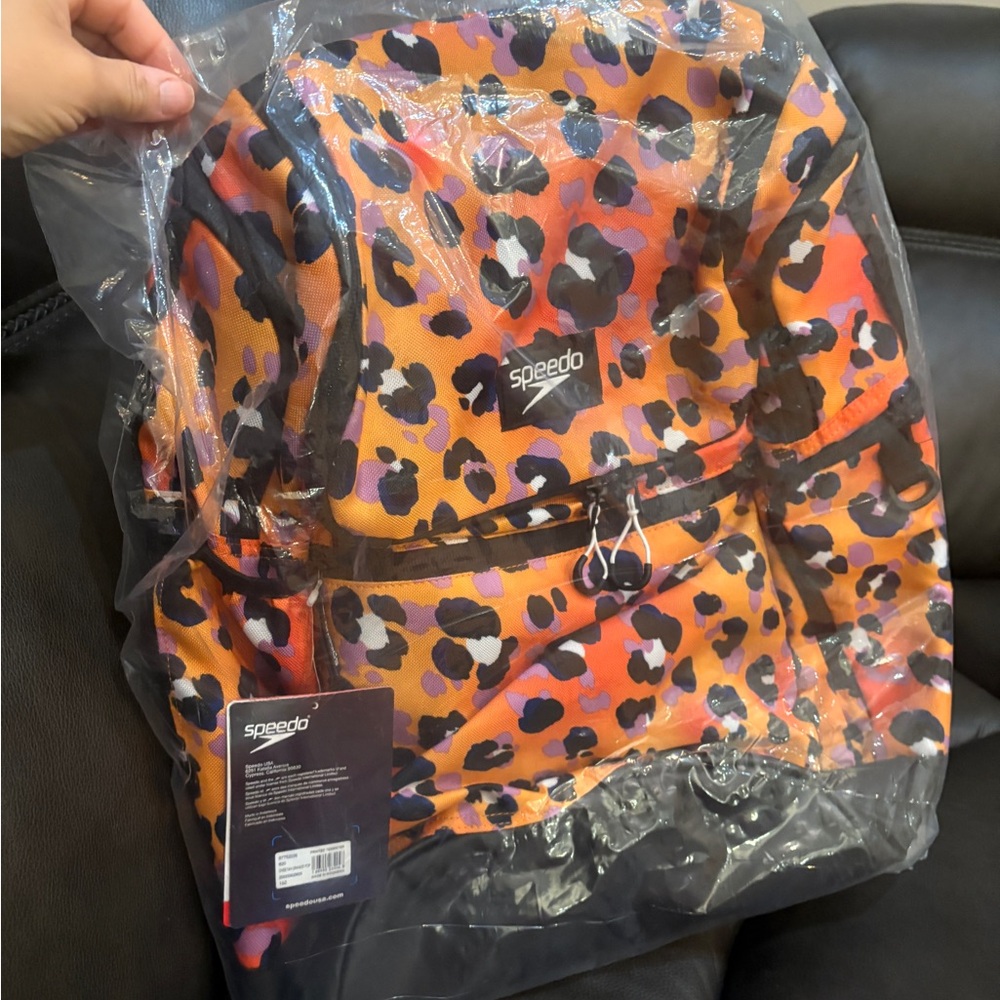 Speedo teamster backpack Orange and Black cheetah print.